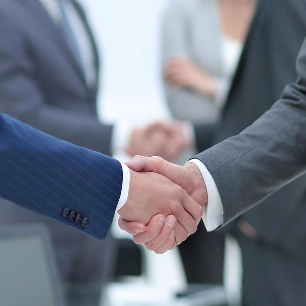 Two attorneys shaking hands.